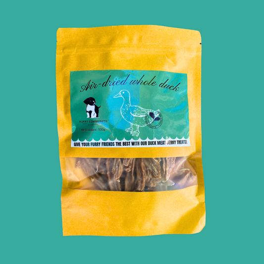 turquoise background with kraft resealable bag. bag contains long strips of duck jerky.