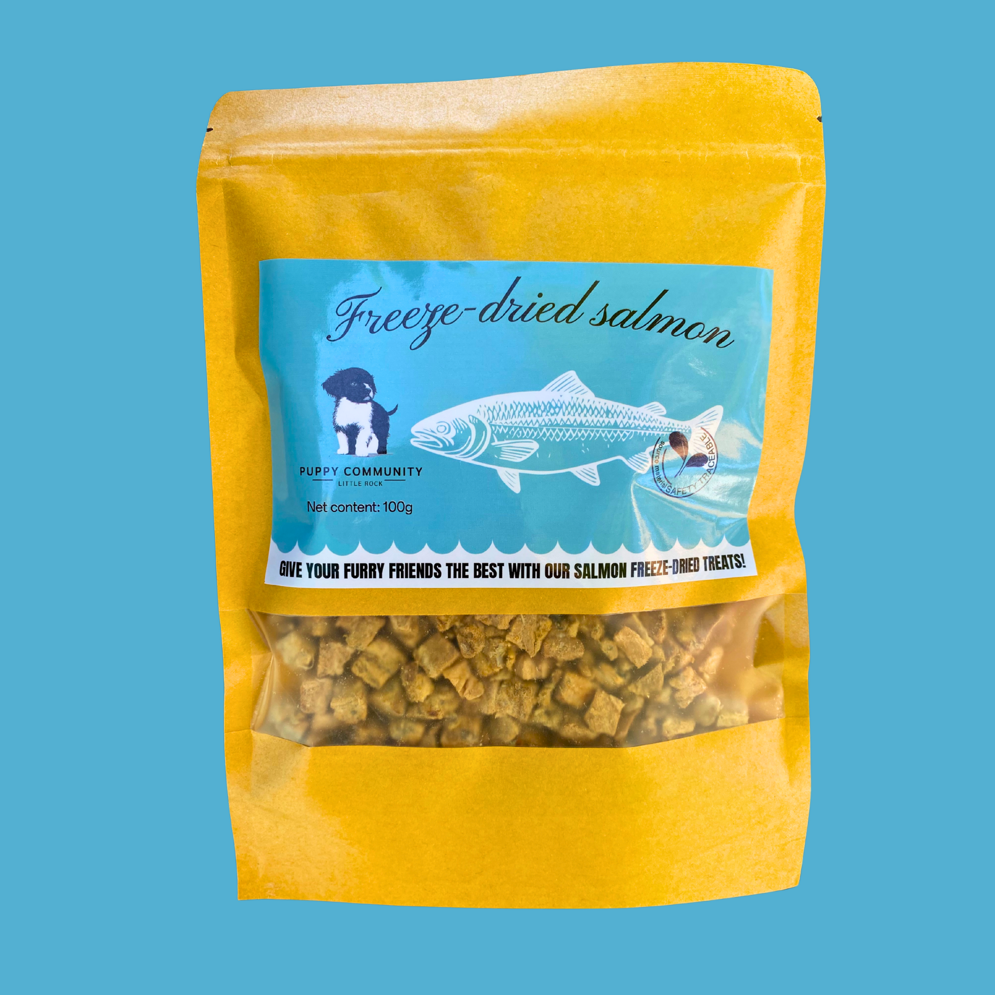 blue background with kraft resealable bag. bag contains small square pieces of freeze dried salmon.