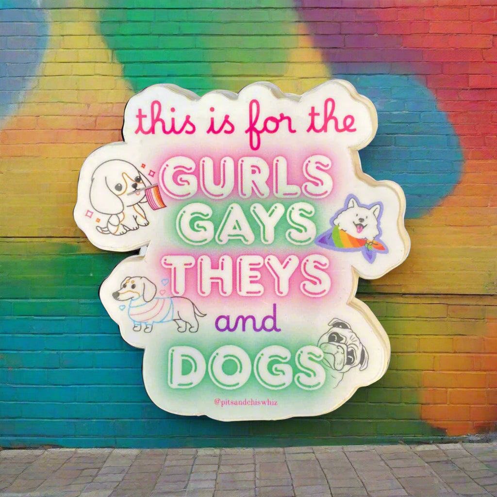 Sticker with text 'this is for the gurls gays theys and dogs' on a dark background