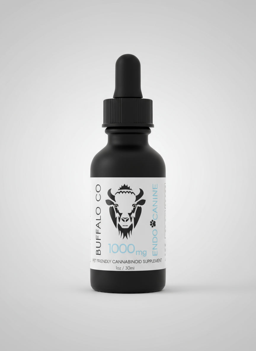 Bottle on a desk with a person sitting at a table in the background