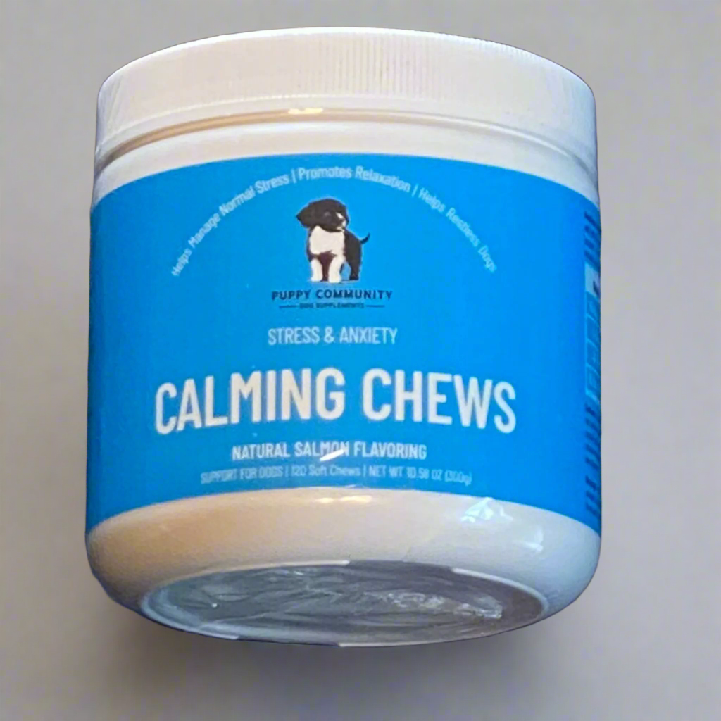 Container of dog calming chews with blue label on dark background