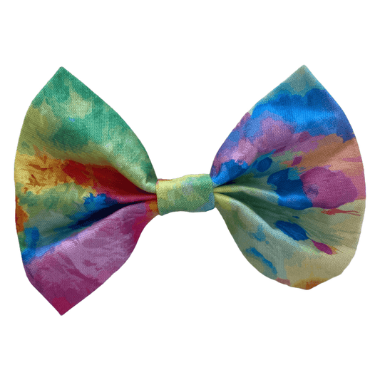 tie dye bow tie for dogs. two white velcro strips attach to collar.