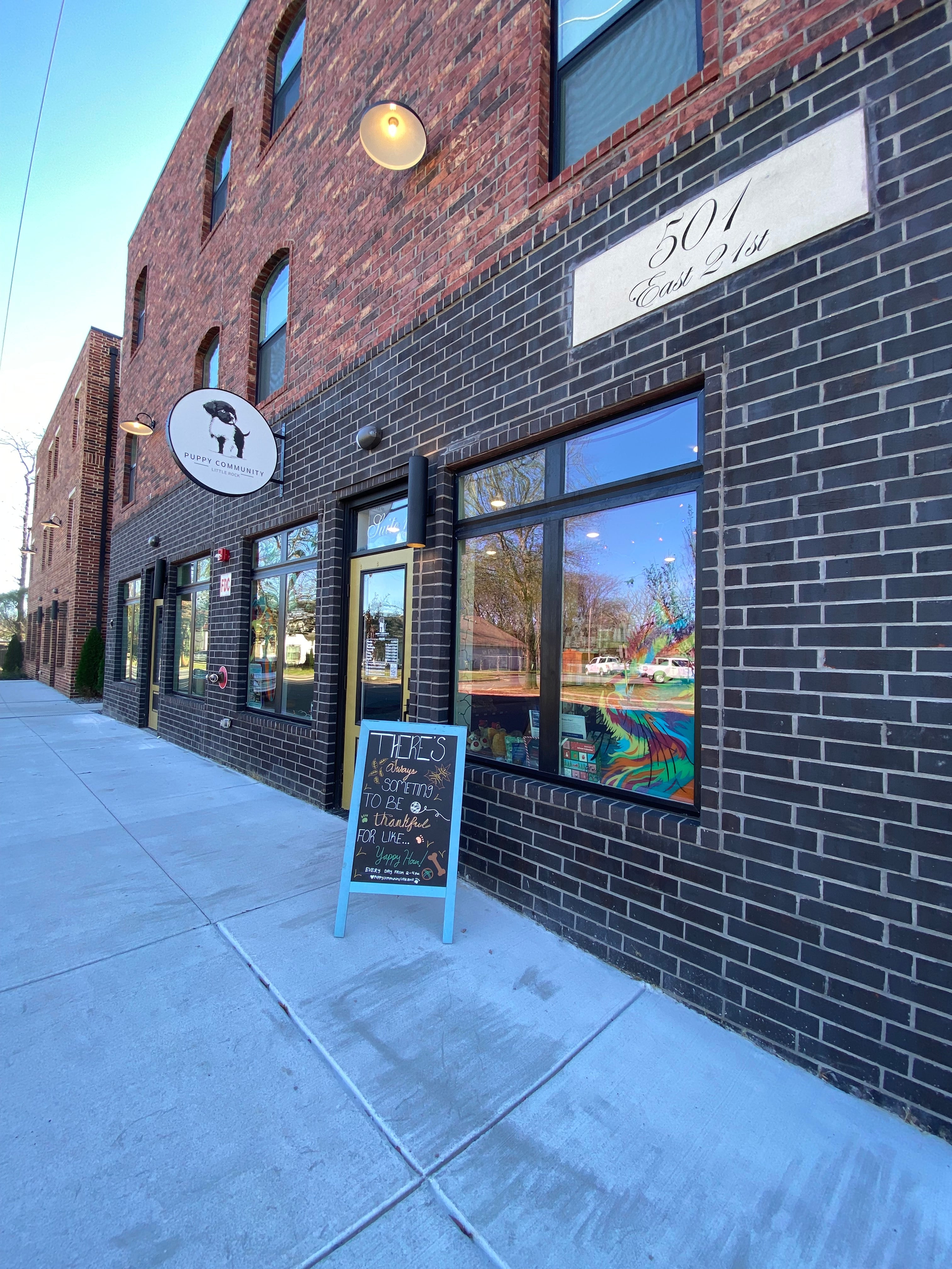 Top-down view of a building with a tiled roof and brick walls.